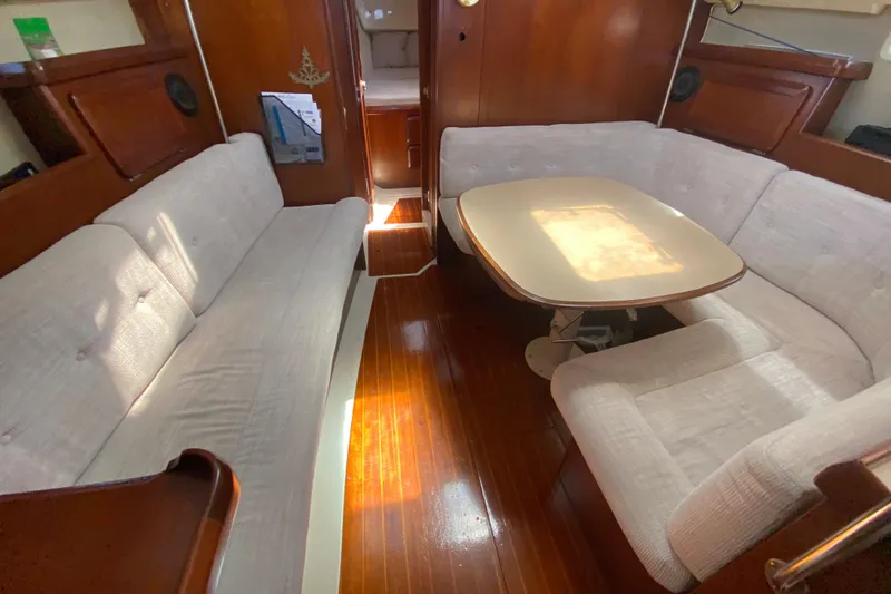 Slide: The Image of Interior of a 1995 Hunter 33.5 sailboat with cozy seating and wooden finishes. - 30