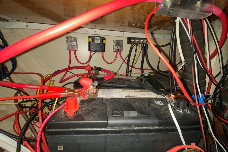 Slide: The Image of Battery compartment with wiring in a 1995 Hunter 33.5 model boat. - 41