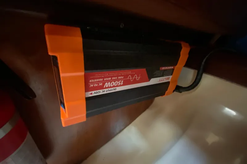 Slide: The Image of Orange and black 1500W power inverter installed in a 1995 Hunter 33.5 boat. - 45