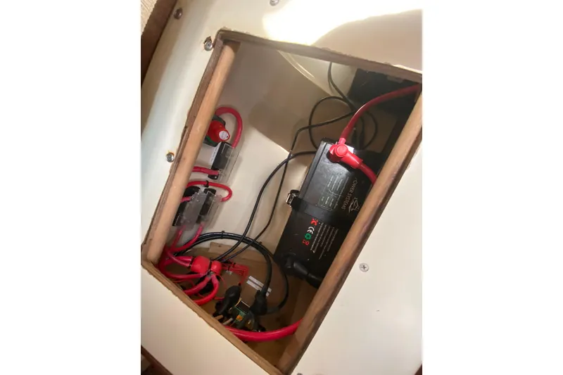 Slide: The Image of Electrical compartment of a 1995 Hunter 33.5 boat with battery and wiring. - 46