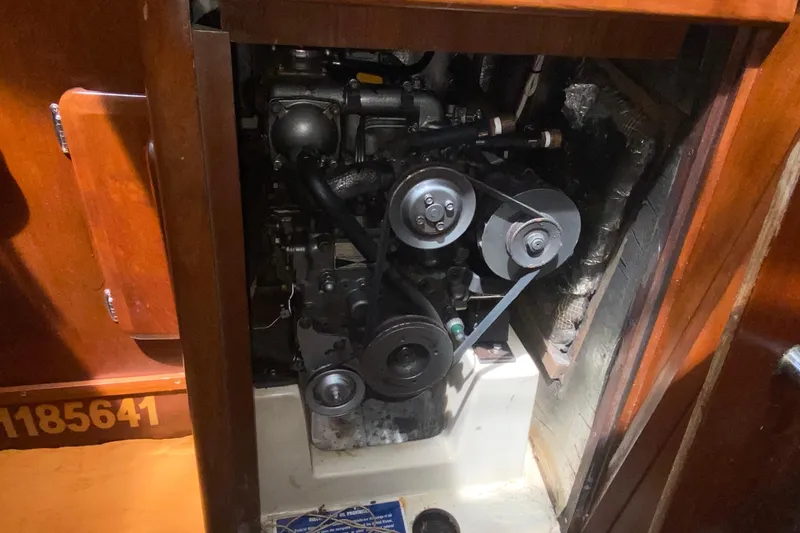 Slide: The Image of Engine compartment of a 1995 Hunter 33.5 sailboat, showcasing mechanical components. - 50