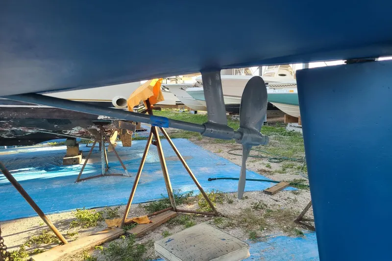 Slide: The Image of Propeller and rudder of a 1995 Hunter 33.5 sailboat on dry dock. - 55