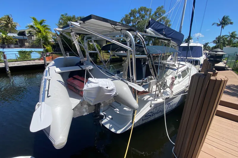 Slide: The Image of Hunter 33.5 sailboat from 1995 docked with inflatable dinghy attached. - 6