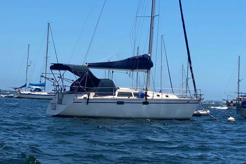 Slide: The Image of Sailboat on water, 1995 Hunter 33.5 model, anchored with other boats in background. - 63