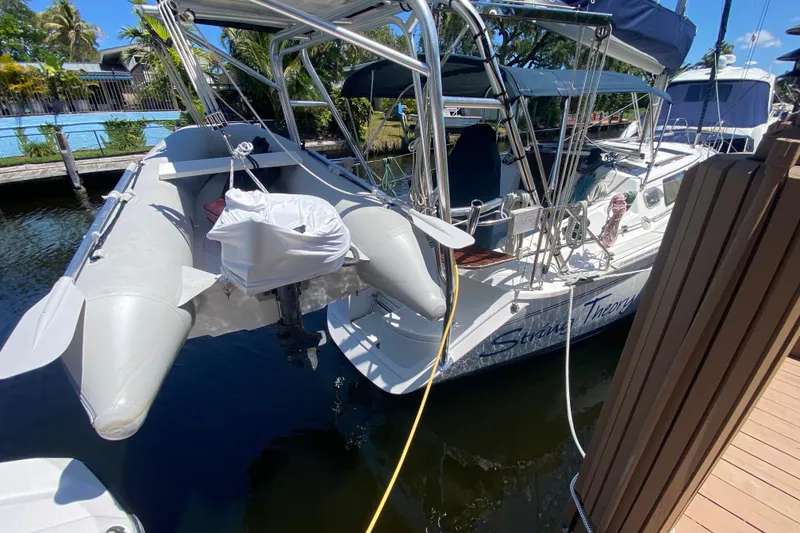 Slide: The Image of Hunter 33.5 sailboat from 1995 docked with inflatable dinghy attached. - 7