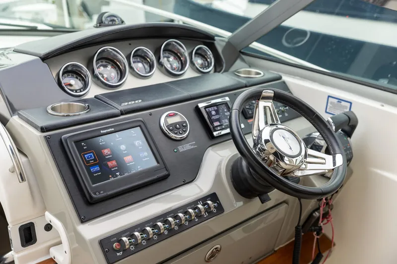 Slide: The Image of Helm of 2015 Sea Ray Sundancer 350 with modern controls and navigation system. - 14