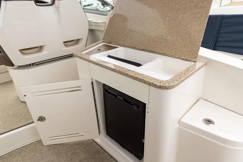 Slide: The Image of Interior of 2015 Sea Ray Sundancer 350 with sink and storage cabinet. - 17