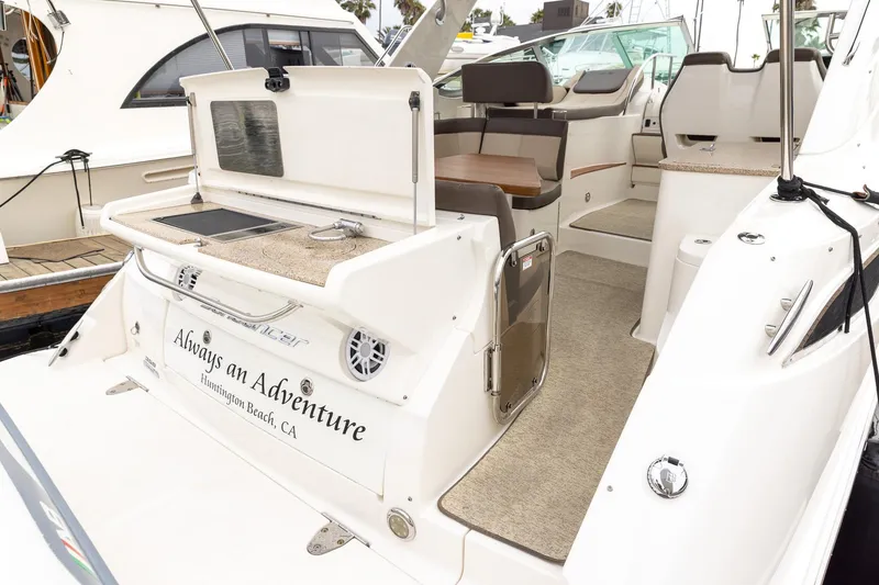 Slide: The Image of 2015 Sea Ray Sundancer 350 yacht with outdoor kitchenette, docked in Huntington Beach. - 18