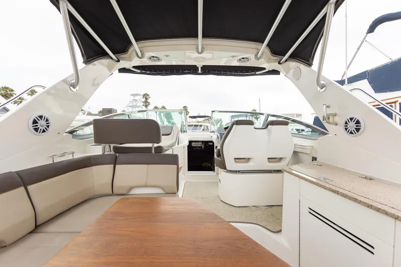 Slide: The Image of Interior view of 2015 Sea Ray Sundancer 350 yacht with seating and helm. - 8