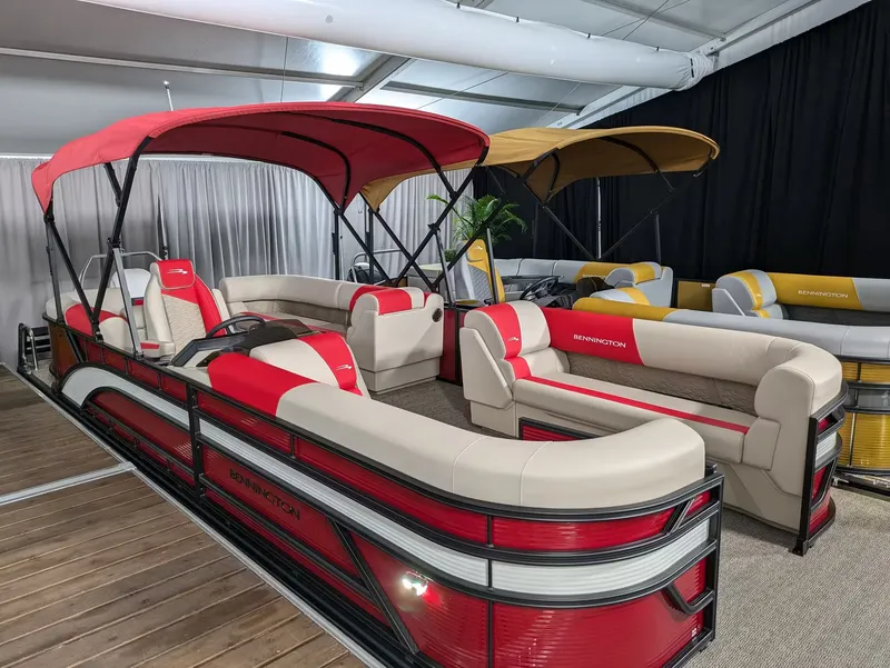 The Image of Bennington 23 SSR 2027 pontoon boat with red canopy and luxurious interior. - 1