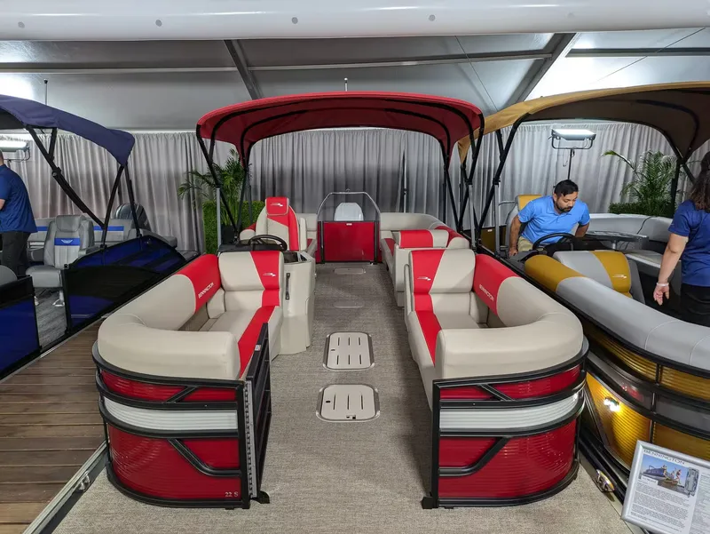 Slide: The Image of 2027 Bennington 23 SSR pontoon boat with red canopy and beige seating. - 3