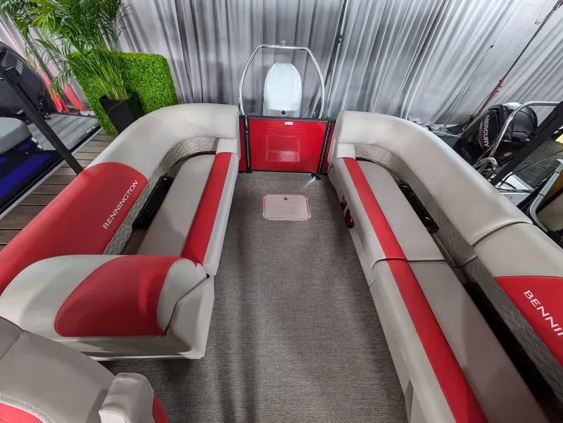 Slide: The Image of Interior of 2027 Bennington 23 SSR with red and gray seating. - 10