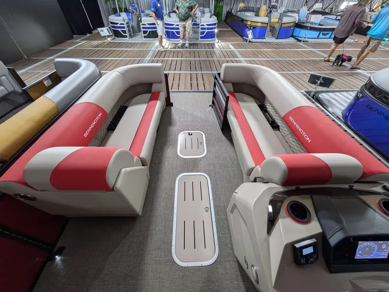 Slide: The Image of Interior of 2027 Bennington 23 SSR with red and beige seating. - 4