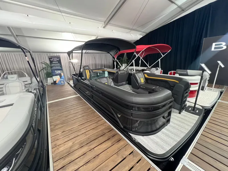 The Image of Bennington 23SL 2027 pontoon boat on display at an exhibition. - 1