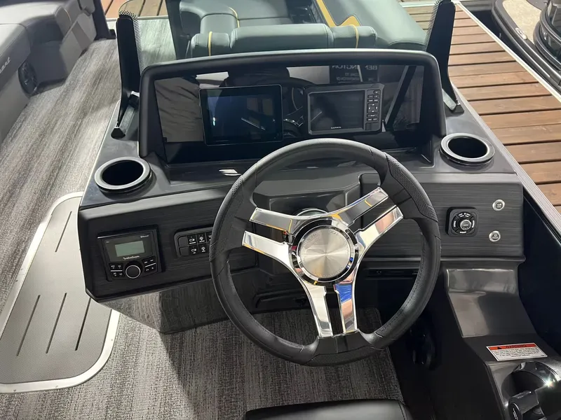 Slide: The Image of Interior view of 2027 Bennington 23SL with modern dashboard. - 6