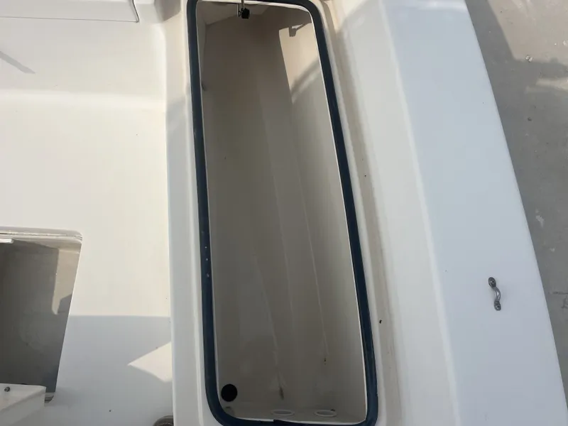 Slide: The Image of Open storage compartment on a 2008 Pathfinder 2200 boat. - 11