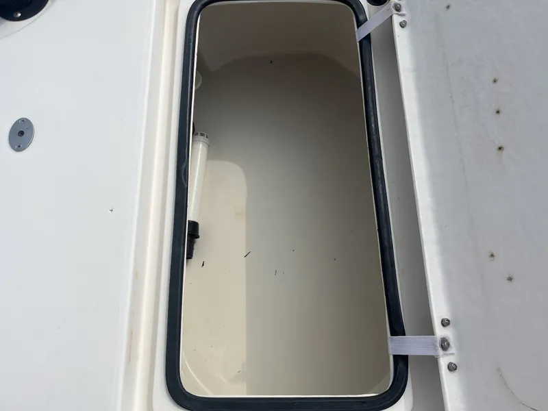 Slide: The Image of Open storage compartment of a 2008 Pathfinder 2200 Tournament Edition boat. - 22