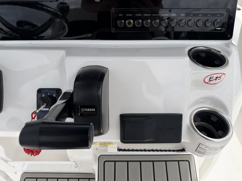 Slide: The Image of Tidewater 2210 Carolina Bay 2026 console with Yamaha throttle control. - 12