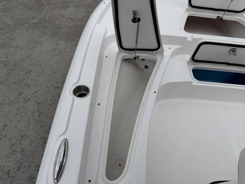 Slide: The Image of 2026 Tidewater 2210 Carolina Bay boat with storage compartments and stainless steel details. - 26