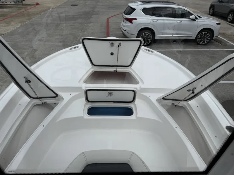 Slide: The Image of 2026 Tidewater 2210 Carolina Bay boat with open storage compartments. - 27