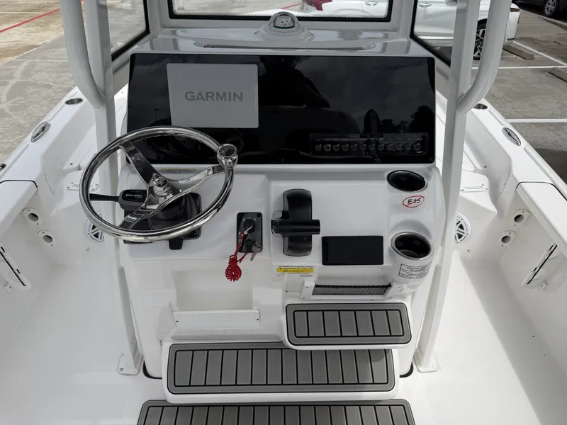 Slide: The Image of 2026 Tidewater 2210 Carolina Bay boat console with Garmin display. - 8