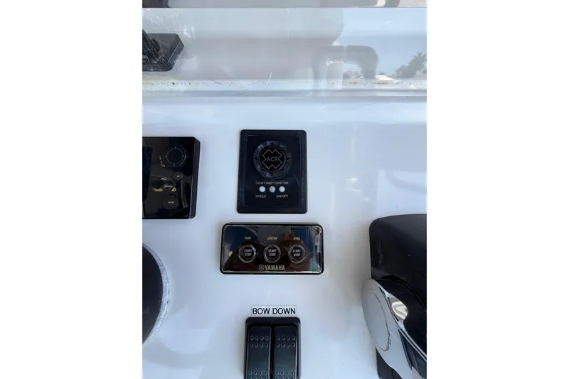 Slide: The Image of Control panel of a 2012 Invincible 42 Open Fisherman boat with Yamaha controls. - 10