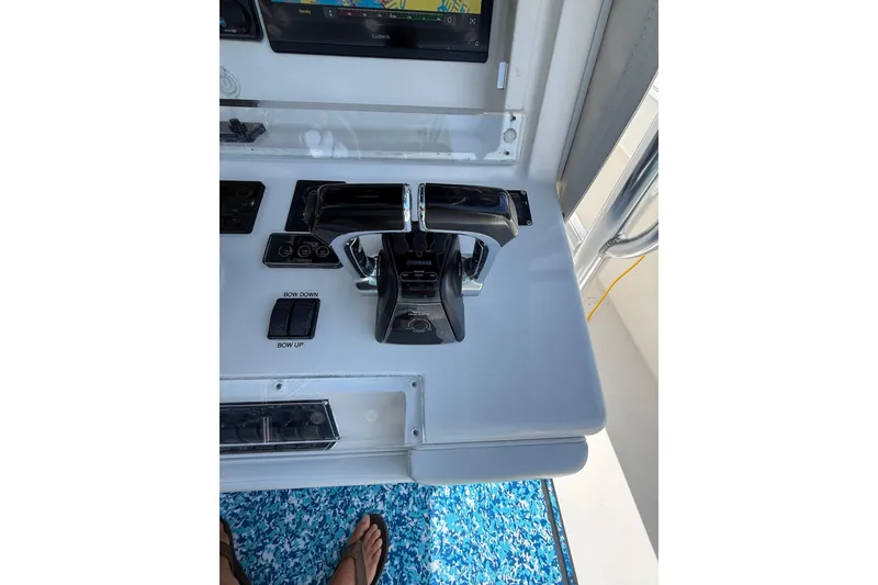 Slide: The Image of Control panel of a 2012 Invincible 42 Open Fisherman boat with Yamaha throttle. - 12