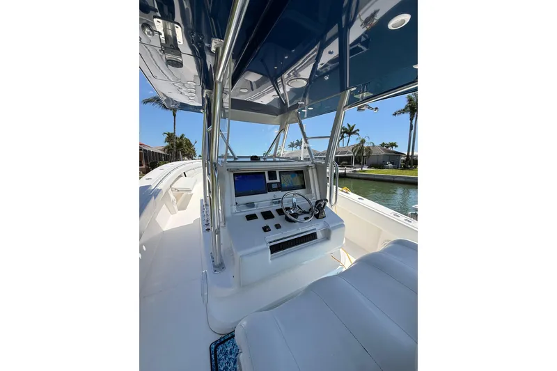 Slide: The Image of 2012 Invincible 42 Open Fisherman boat cockpit with modern navigation equipment. - 14