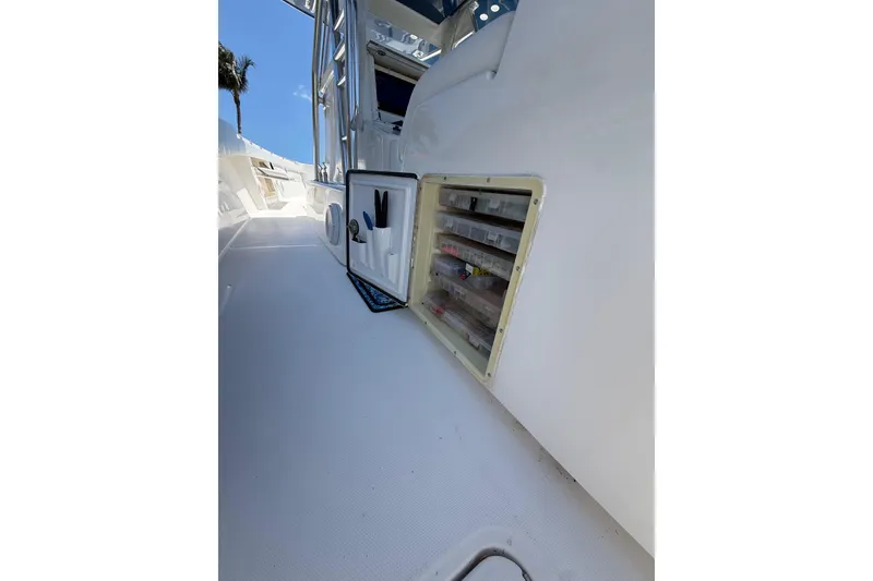 Slide: The Image of 2012 Invincible 42 Open Fisherman boat with open storage compartments on deck. - 17