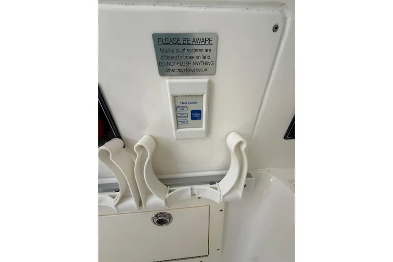 Slide: The Image of Marine toilet warning sign on 2012 Invincible 42 Open Fisherman boat. - 28