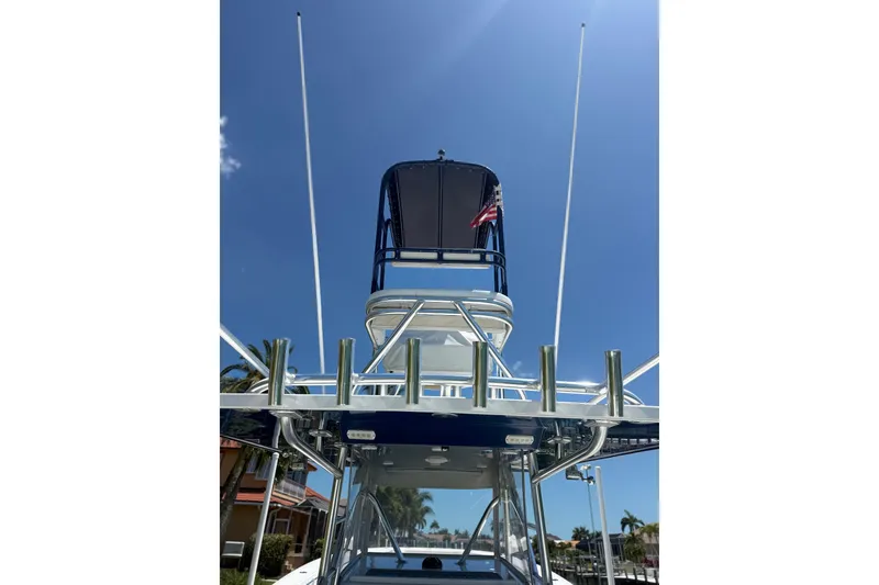 Slide: The Image of 2012 Invincible 42 Open Fisherman boat with tower against clear blue sky. - 35