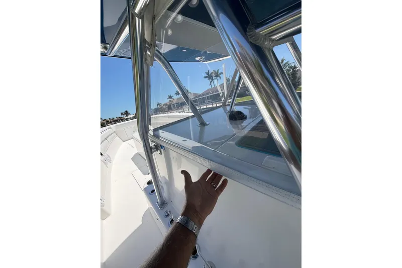 Slide: The Image of 2012 Invincible 42 Open Fisherman boat with stainless steel frame and clear canopy. - 41
