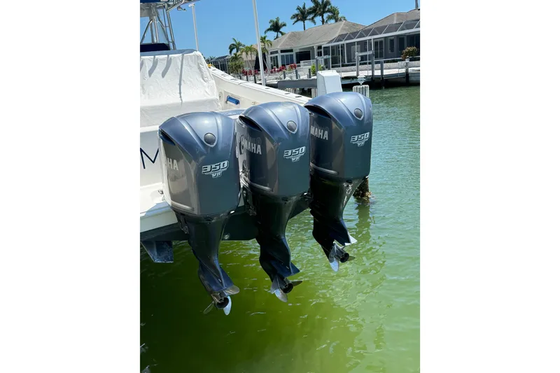 Slide: The Image of Triple Yamaha 350 outboard engines on a 2012 Invincible 42 Open Fisherman boat. - 42