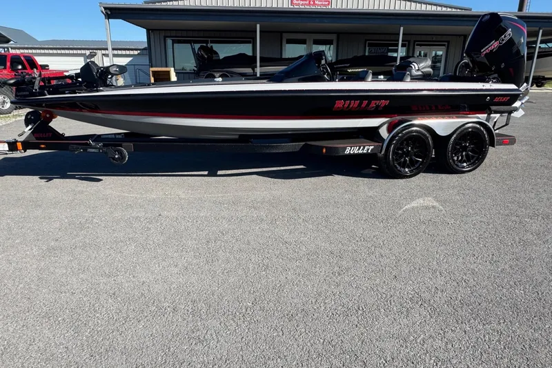 The Image of 2026 Bullet 21XST boat on trailer, sleek design, parked outdoors. - 0