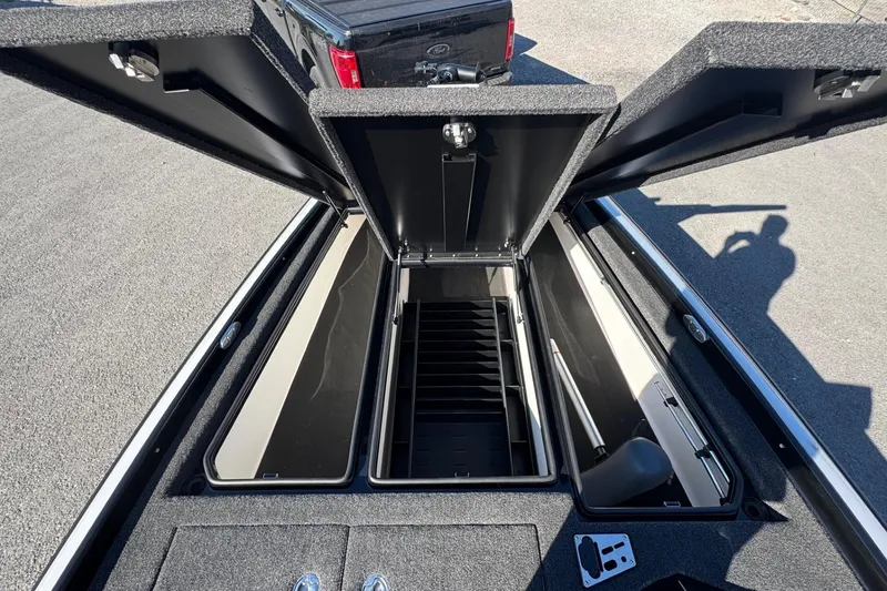 Slide: The Image of Open storage compartments of a 2026 Bullet 21XST boat, showcasing spacious interior design. - 5