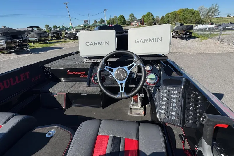 Slide: The Image of 2026 Bullet 21XST boat cockpit with Garmin displays and steering wheel. - 7