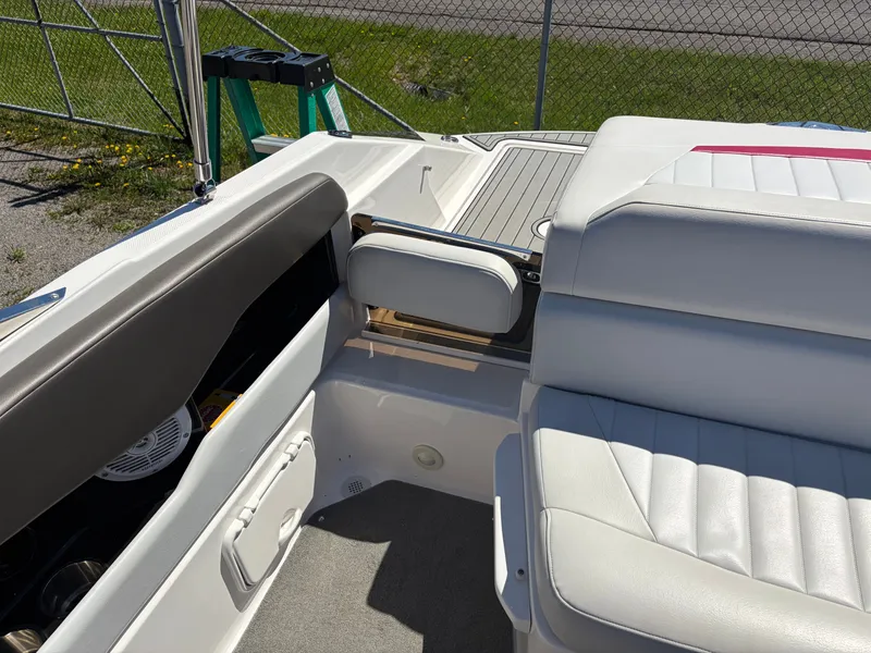 Slide: The Image of Interior of a 2008 Regal 2200 Bowrider boat with white seating. - 13