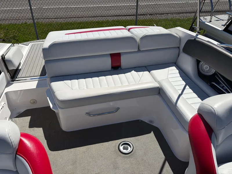 Slide: The Image of Interior of a 2008 Regal 2200 Bowrider with white and red seating. - 15
