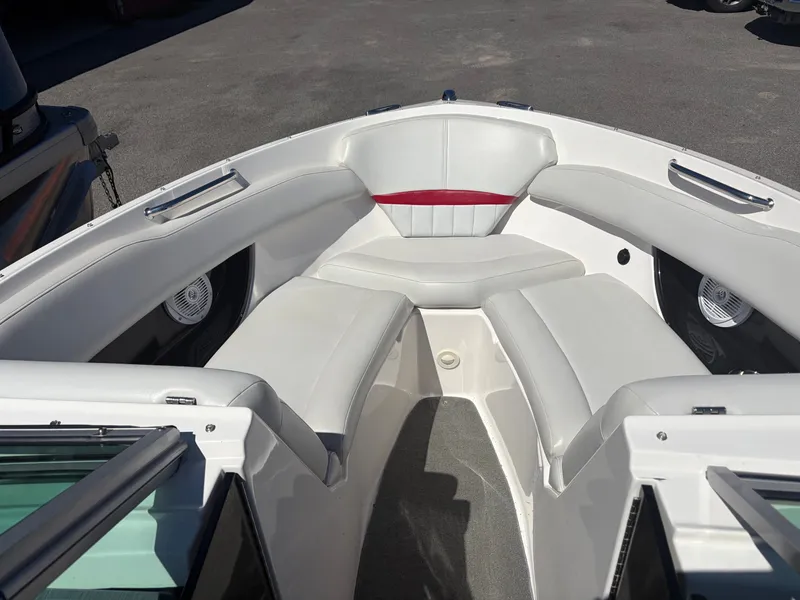 Slide: The Image of Interior view of a 2008 Regal 2200 Bowrider boat with white seating. - 18