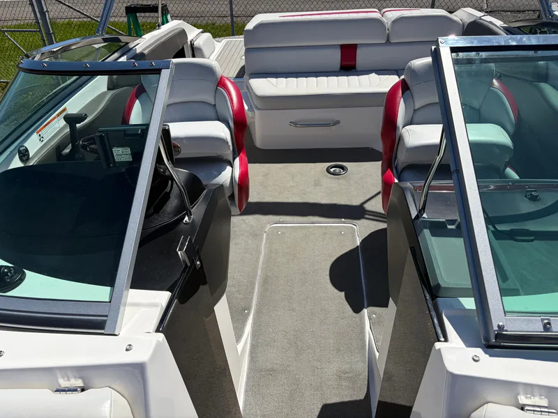 Slide: The Image of Interior of a 2008 Regal 2200 Bowrider boat with seating. - 19
