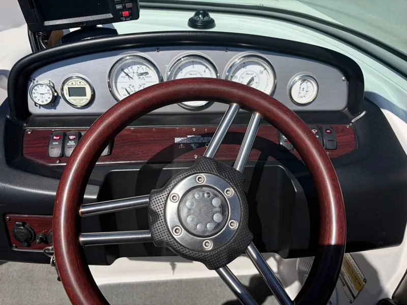 Slide: The Image of Dashboard of a 2008 Regal 2200 Bowrider boat with wood accents. - 20