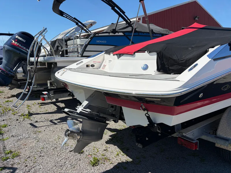 Slide: The Image of 2008 Regal 2200 Bowrider boat parked on a trailer. - 6