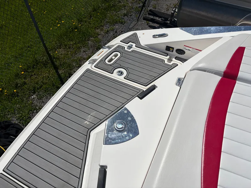 Slide: The Image of Regal 2200 Bowrider 2008 boat deck with gray and red accents. - 8