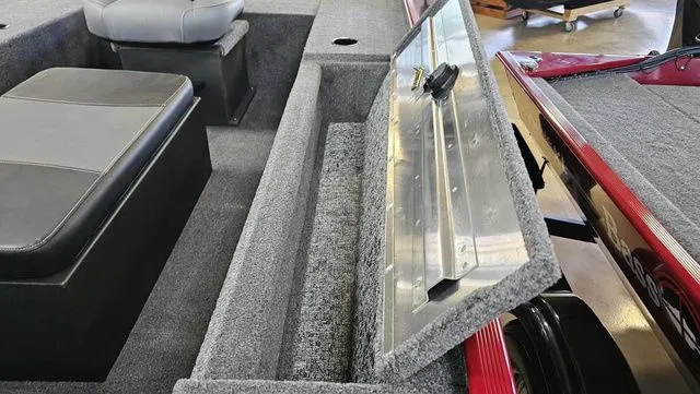 Slide: The Image of Interior of 2026 Tracker Panfish 17 boat with open storage compartment lid. - 9