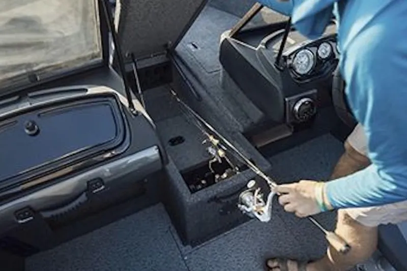 Slide: The Image of 2026 Crestliner 1750 Hawk WT interior with fishing rod storage and dashboard view. - 5