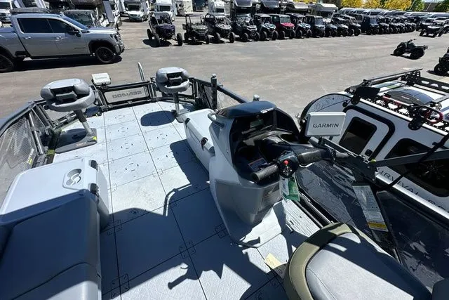 Slide: The Image of 2026 Sea-Doo PB SWT FISH 21 300 GN displayed outdoors. - 15
