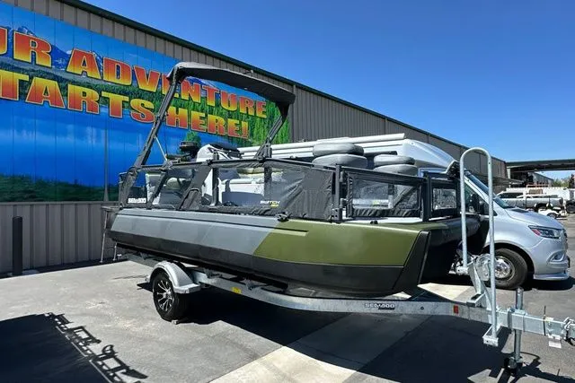 Slide: The Image of 2026 Sea-Doo PB SWT FISH 21 300 GN on trailer outside warehouse. - 24