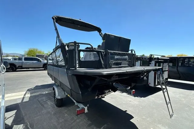 Slide: The Image of 2026 Sea-Doo PB SWT FISH boat with ladder, parked on a trailer. - 28
