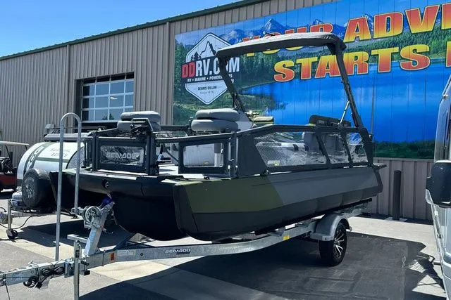 Slide: The Image of Sea-Doo PB SWT FISH 21 300 GN 2026 on trailer outside building. - 30