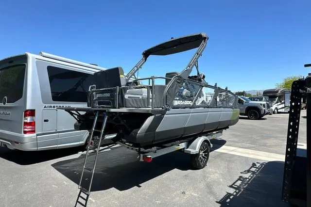 Slide: The Image of Sea-Doo PB SWT FISH 21 300 GN 2026 on trailer beside RV. - 42